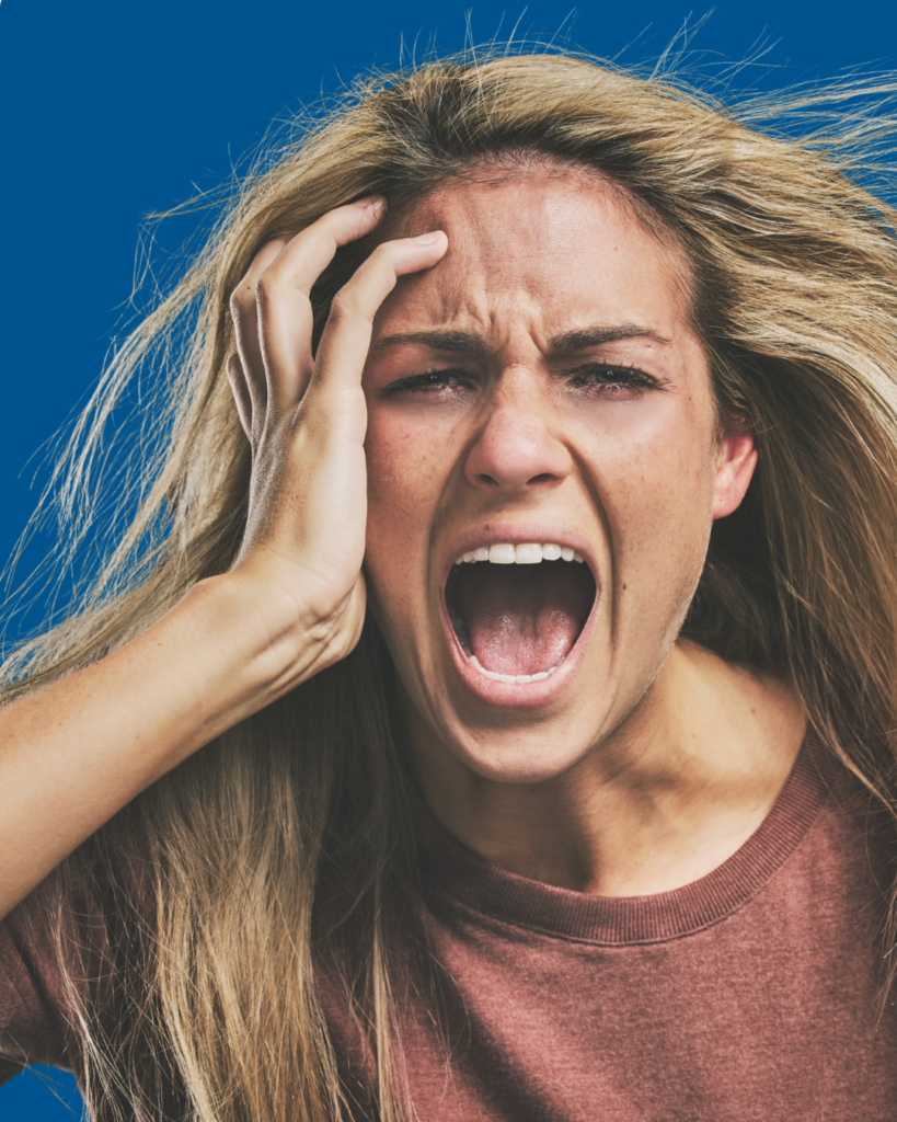 blonde woman holding face looking stressed